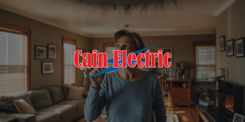 Gray Summit MO homeowner reacting to burning smell in living room indicating urgent electrical issue in Franklin County home